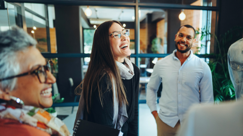 woman laughing and collaborating with B2B agency partners and colleagues