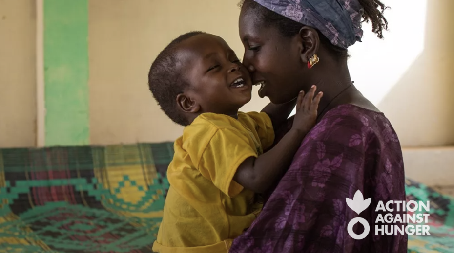 mother and son with action against hunger logo in Bottom right corner